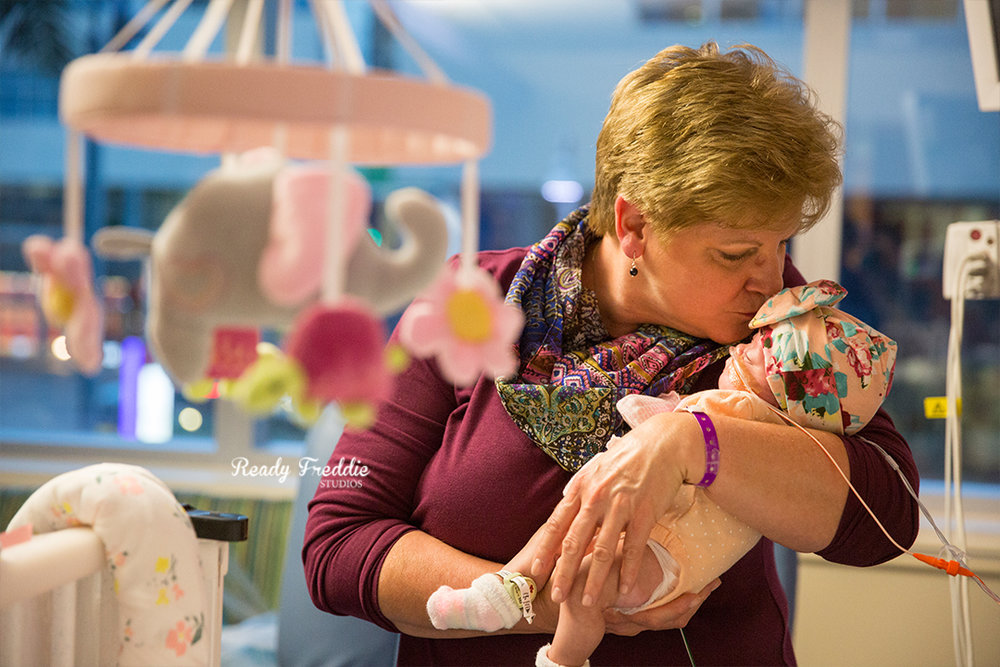 Grandma kissing premie baby at South Miami Hospital