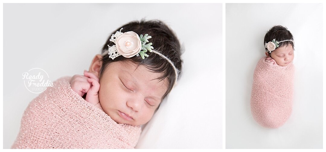 Fort Lauderdale newborn photographer captures baby girl wrapped in a pink swaddle wearing a delicate headband