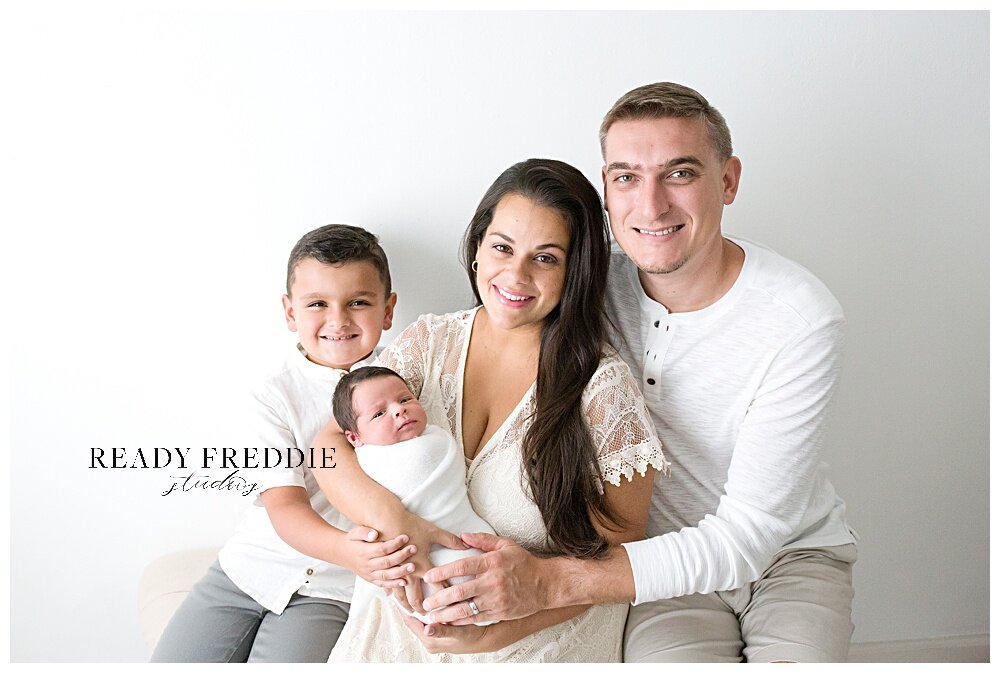 Family Newborn photos in all white photography studio | Ready Freddie Studios - Miami, FL