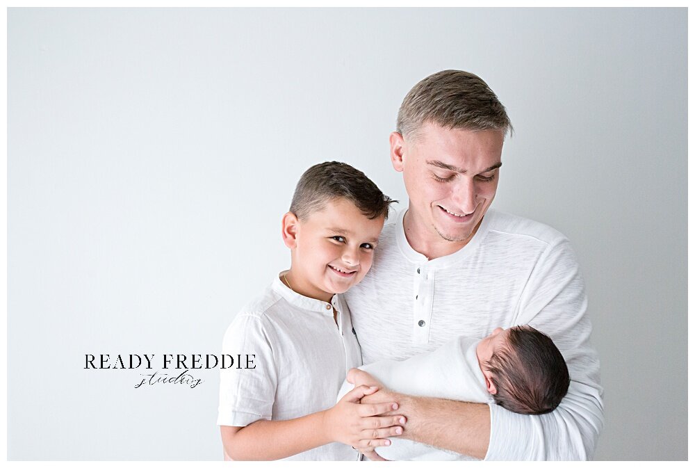 Dad and his kids during newborn photography session | Ready Freddie Studios - Miami, FL