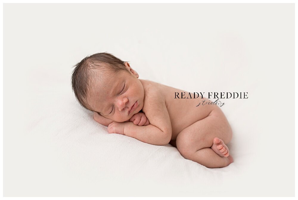 Newborn baby sleeping during his photography session in South Florida | Ready Freddie Studios - Miami, FL