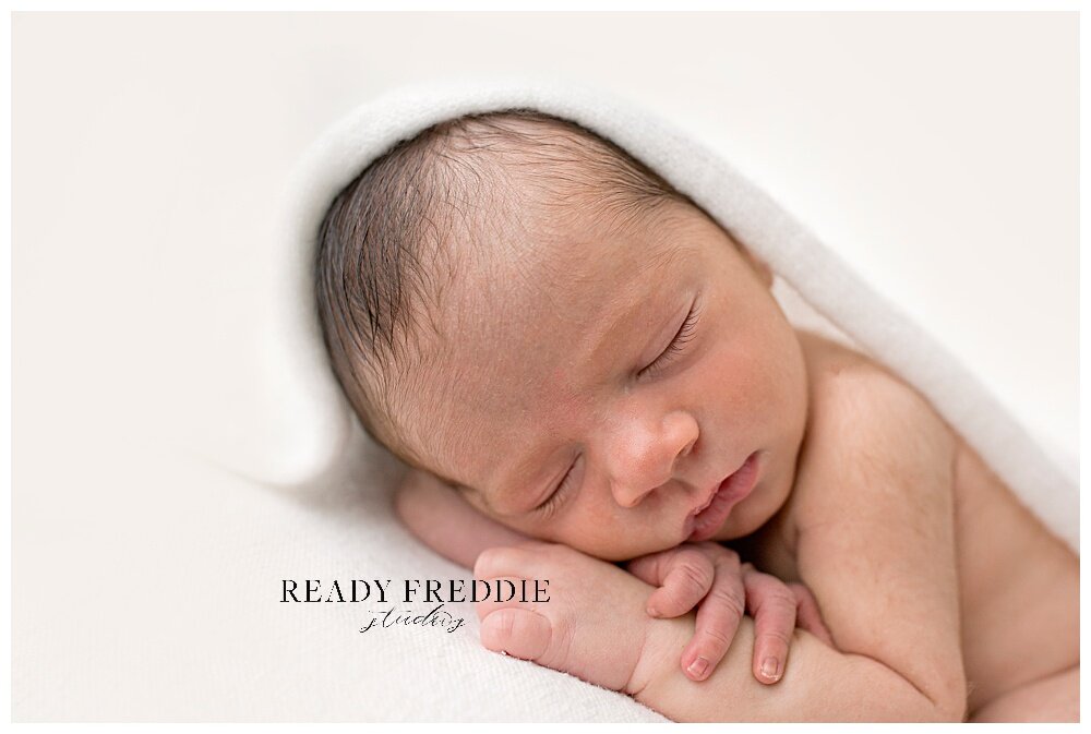 Sweet baby boy in all white photography studio in Coral Gables | Ready Freddie Studios - Miami, FL