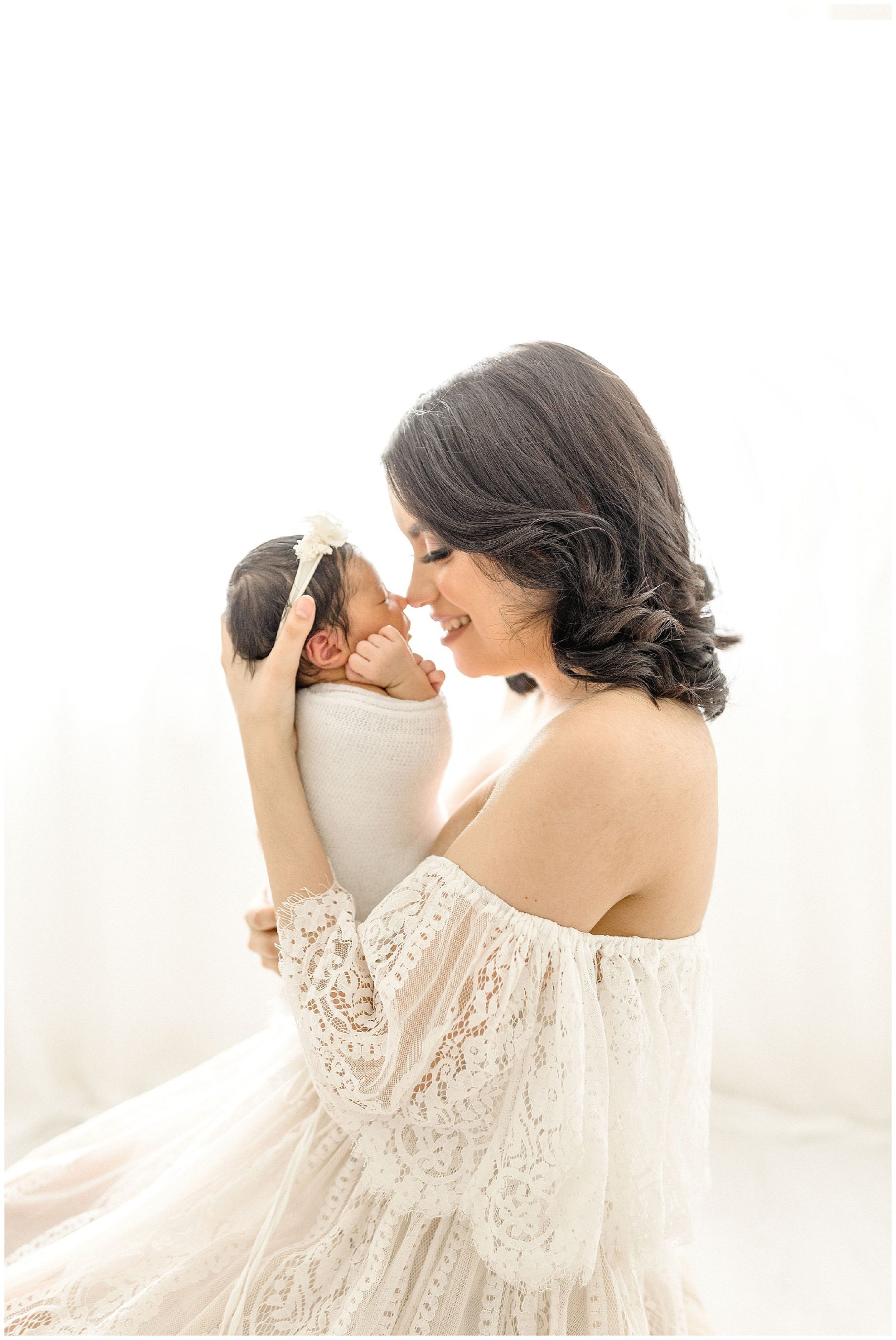 Mom nose to nose with daughter. Photo by Ivanna Vidal Photography.
