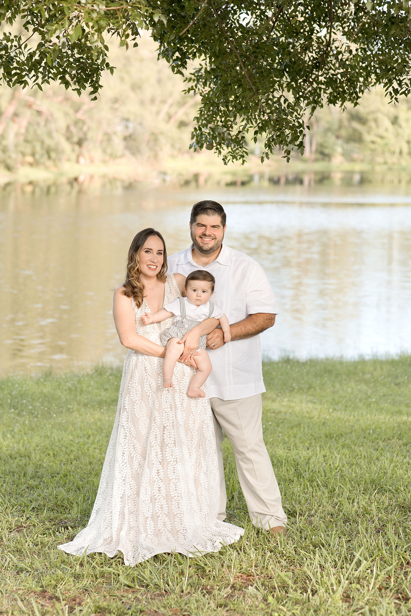 Family of three poses with young son during Miami Children Photography session. Photo by Ivanna Vidal Photography.