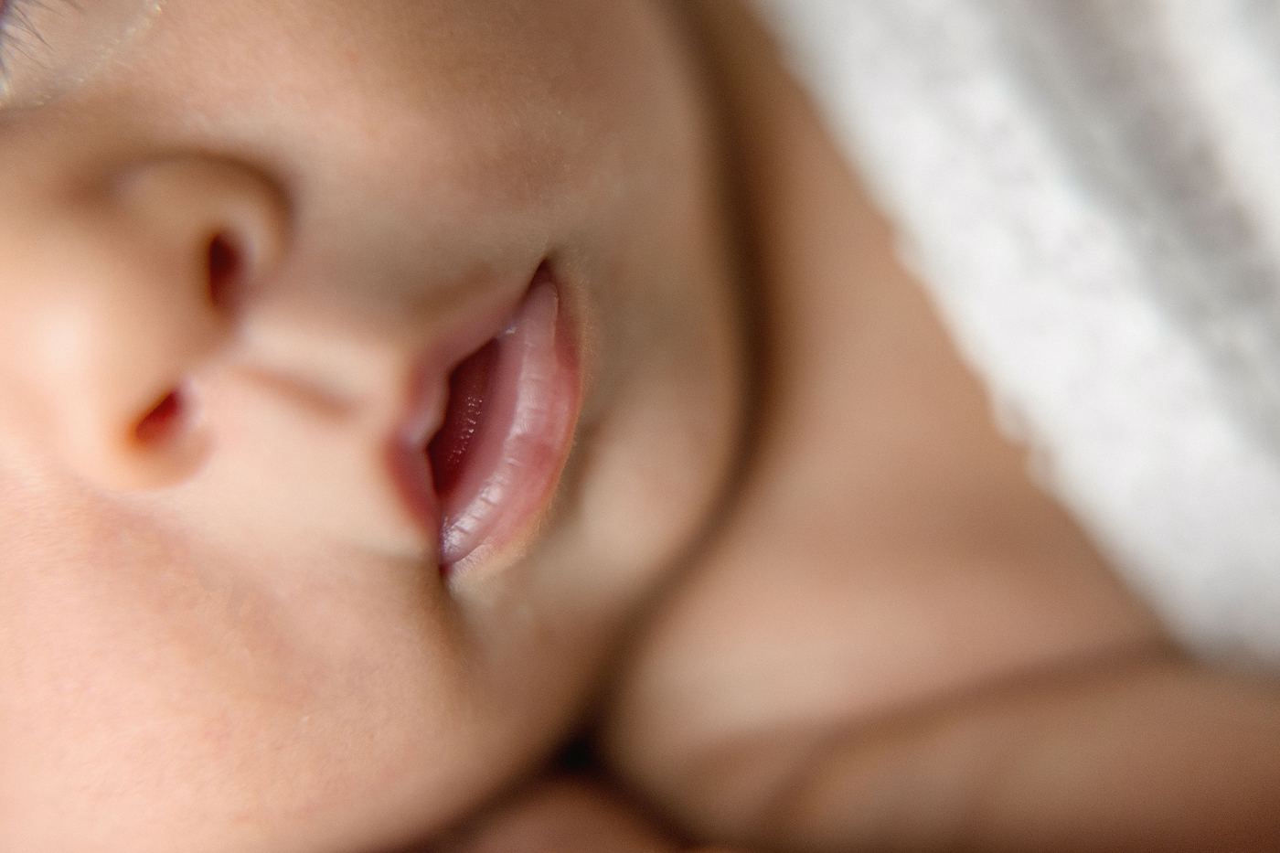 Macro shot of baby girls lips during Newborn Photography Miami session. Photo by Ivanna Vidal Photography.