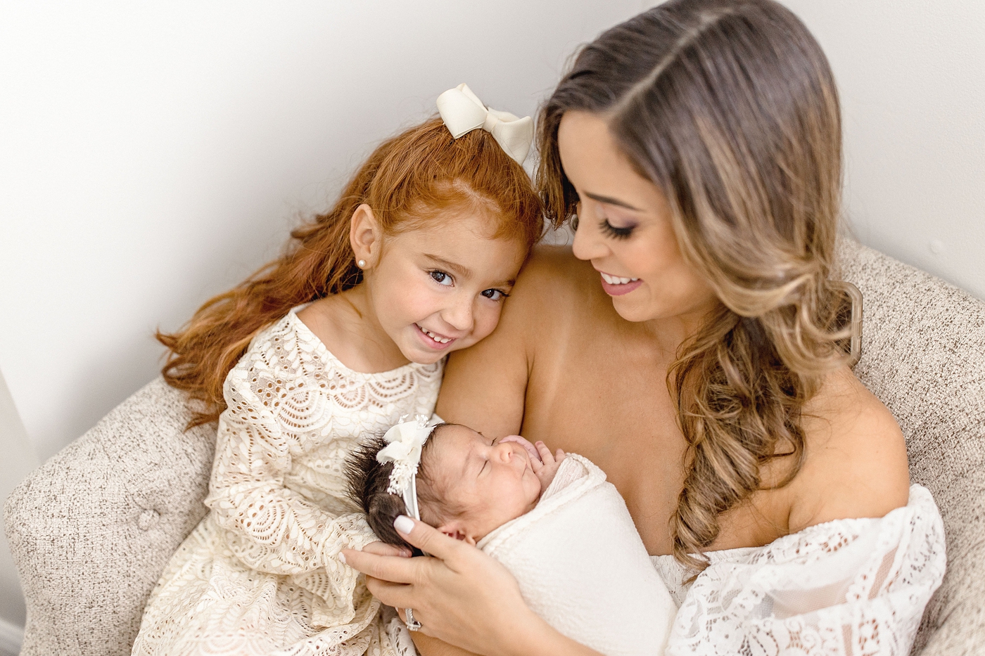 Mom and her two daughters. during in home Miami Lifestyle newborn session. Photo by Ivanna Vidal Photography.