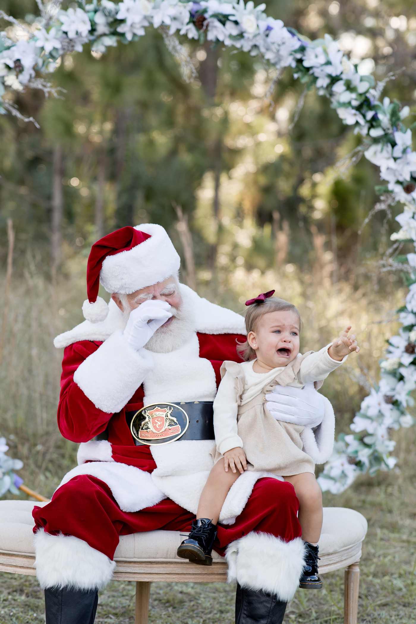 Santa and little girl cry together. Photo by Ivanna Vidal Photography.