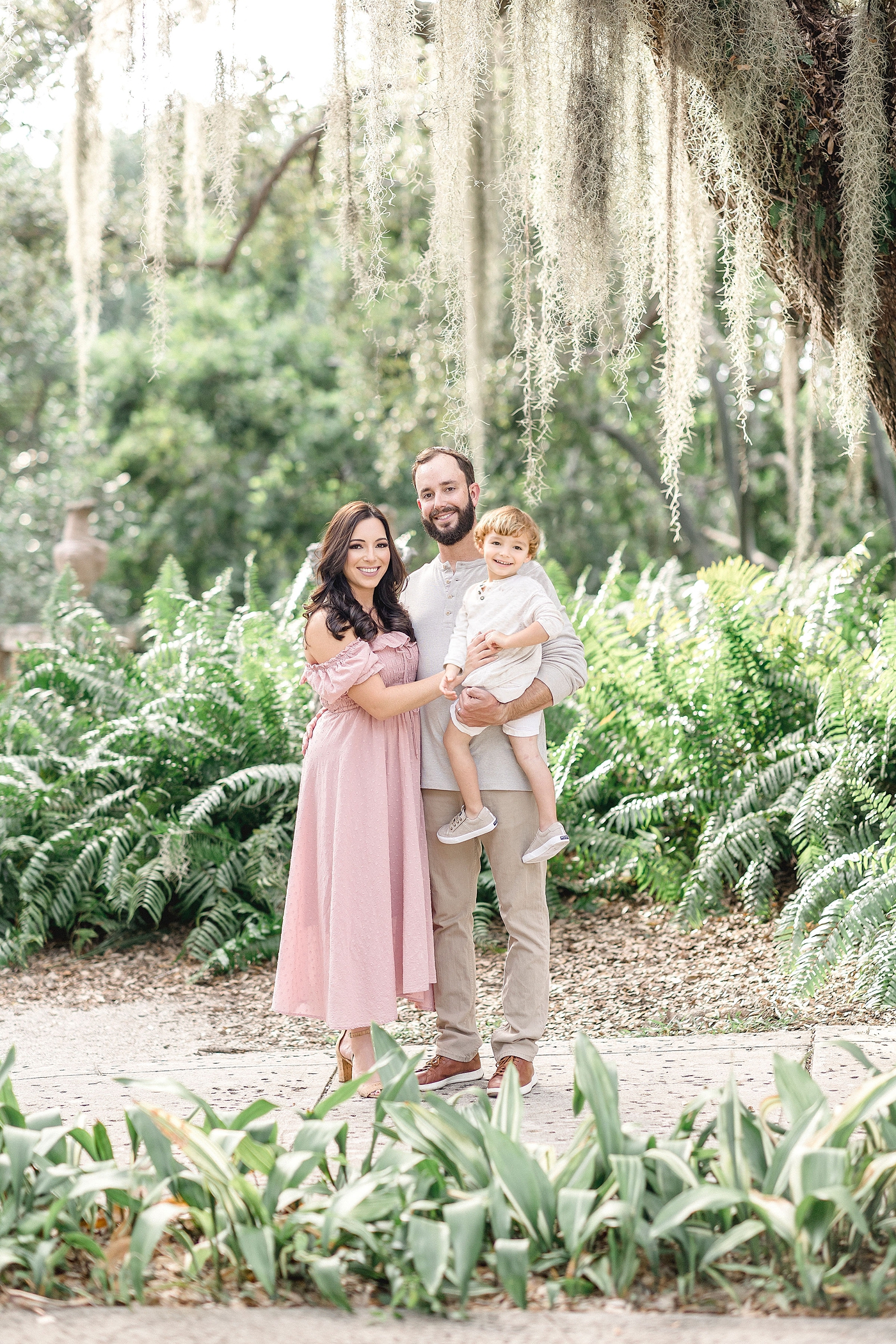 Beautiful family portrait in front of Spanish moss at Vizcaya Museum and Gardens in Miami. Images by Ivanna Vidal Photography.
