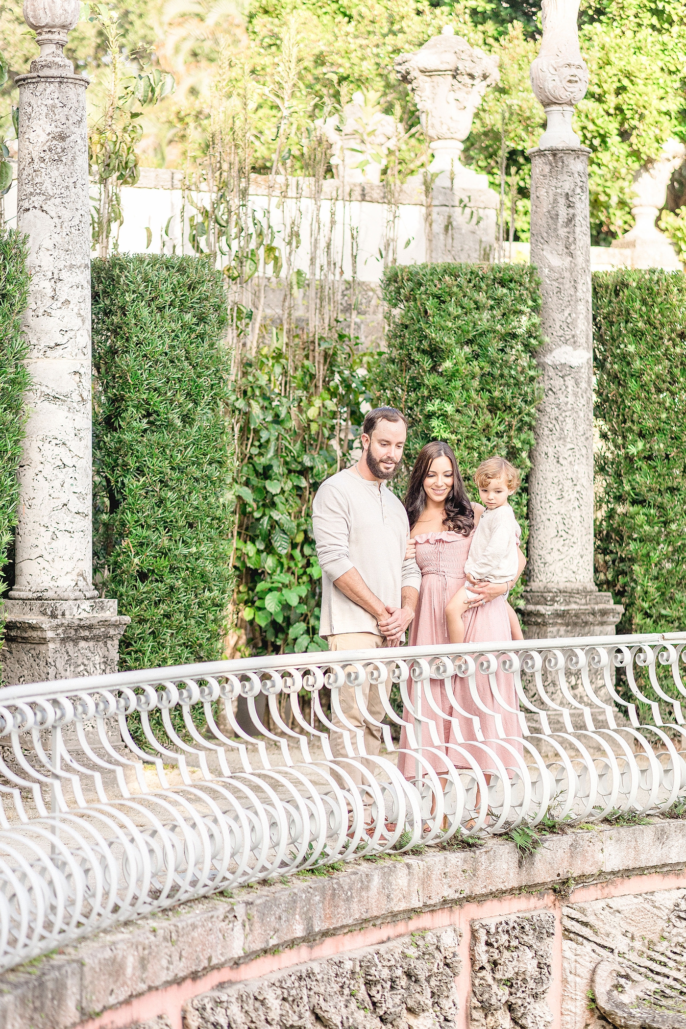 Miami family photoshoot looking at the gardens of Vizcaya. Photo by Ivanna Vidal Photography.