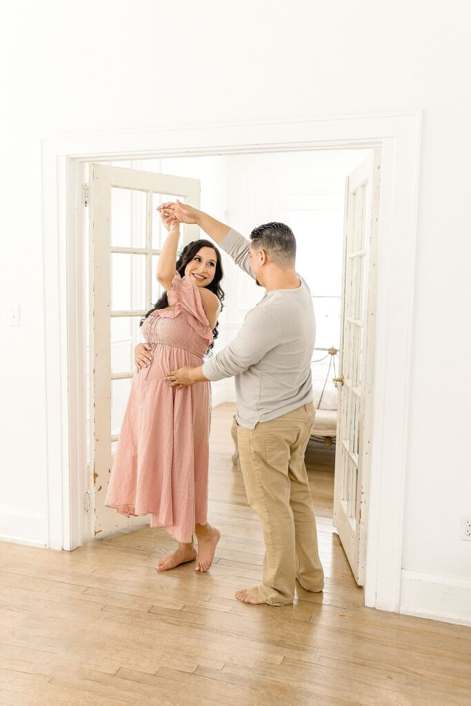 pregnant mom and dad dancing in the house best maternity hospitals in Miami