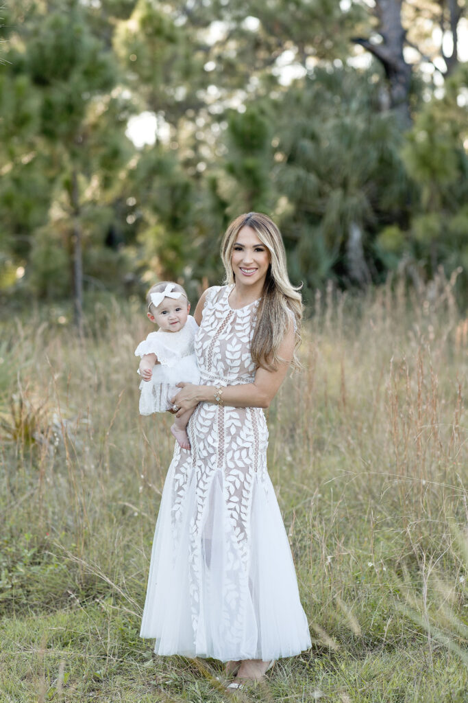 New mom holding her baby girl at AD Barnes Park Maternity Photoshoot locations in Miami